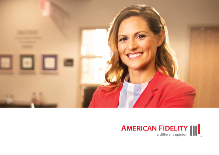 smiling female professional with red jacket on